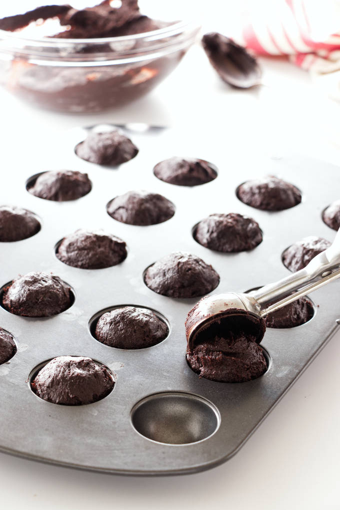 Brownie bites being scooped into donut-hole pan