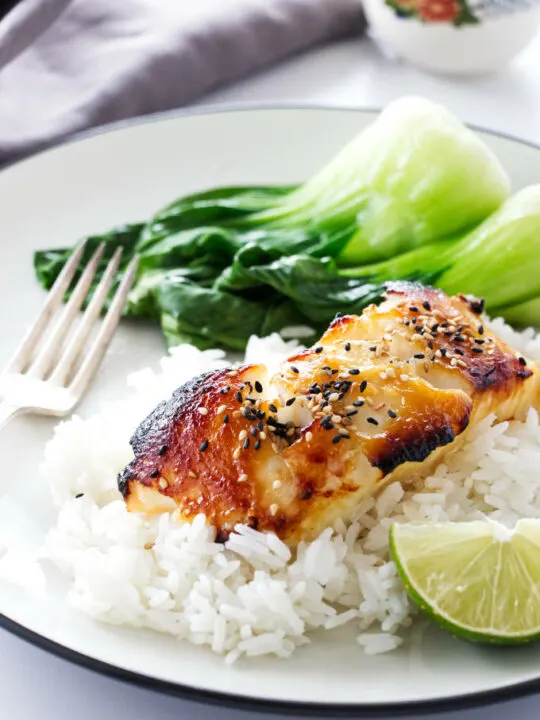 A serving of Miso Glazed Sea Bass on rice with baby bok choy