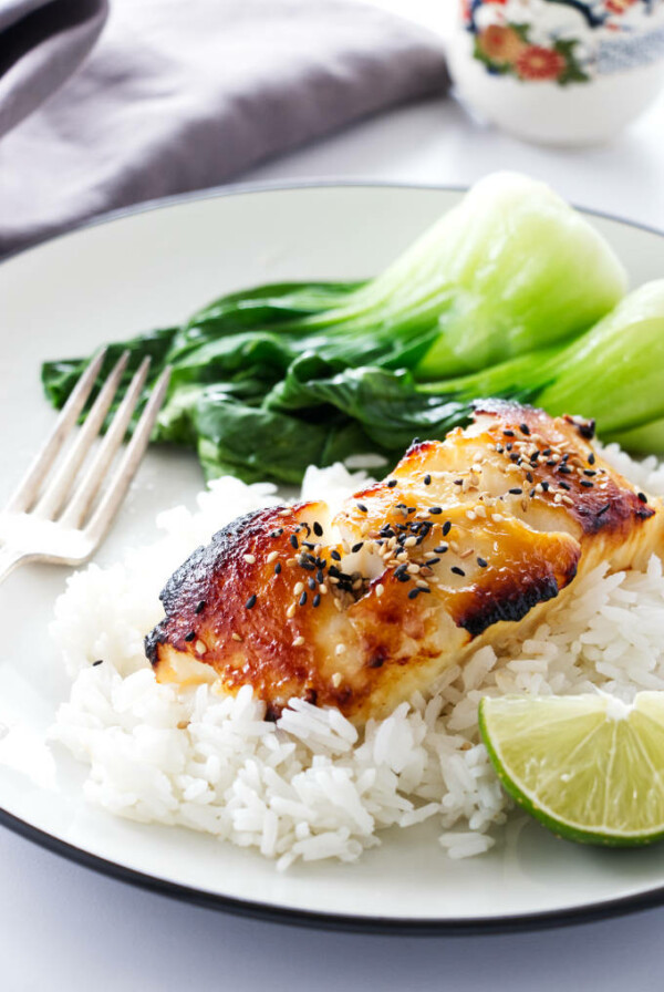 A serving of Miso Glazed Sea Bass on rice with baby bok choy