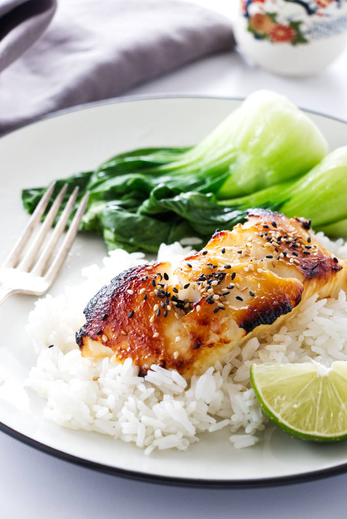 A serving of Miso Glazed Sea Bass on rice with baby bok choy