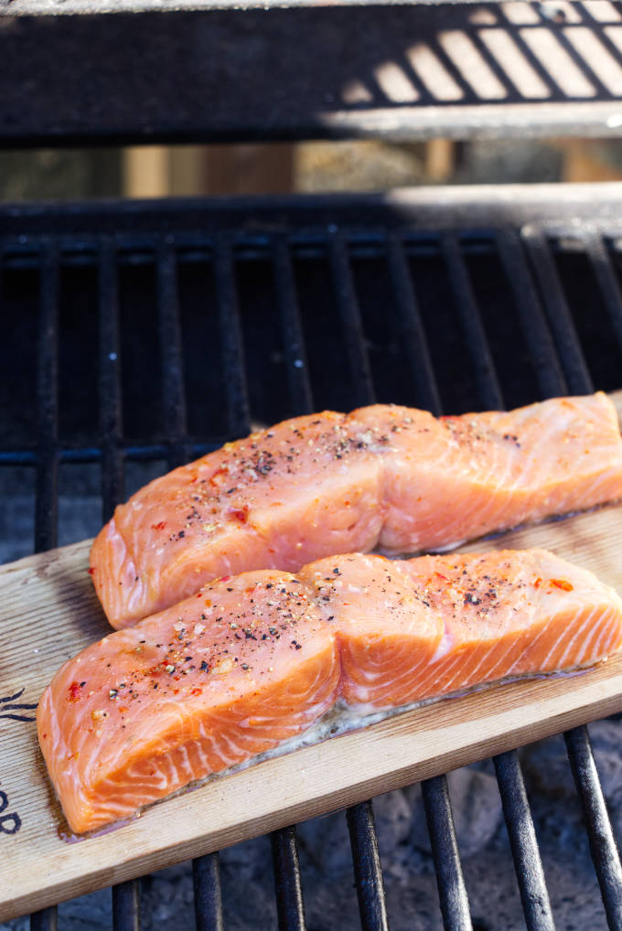 2 salmon fillets on a cedar plank