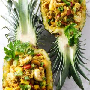 Pineapple fried rice in pineapple bowls.