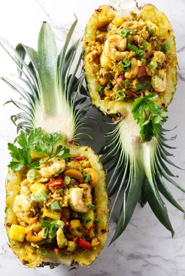 Pineapple fried rice in pineapple bowls.