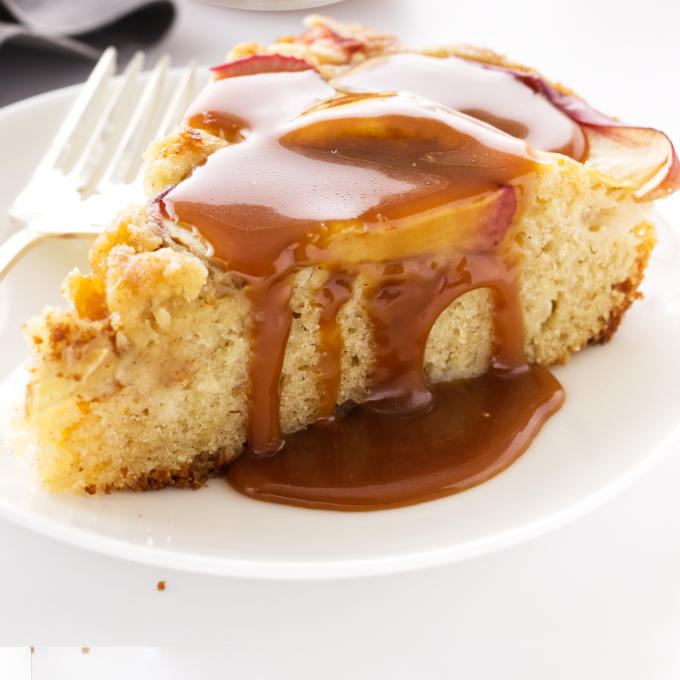a slice of apple skillet cake with caramel sauce
