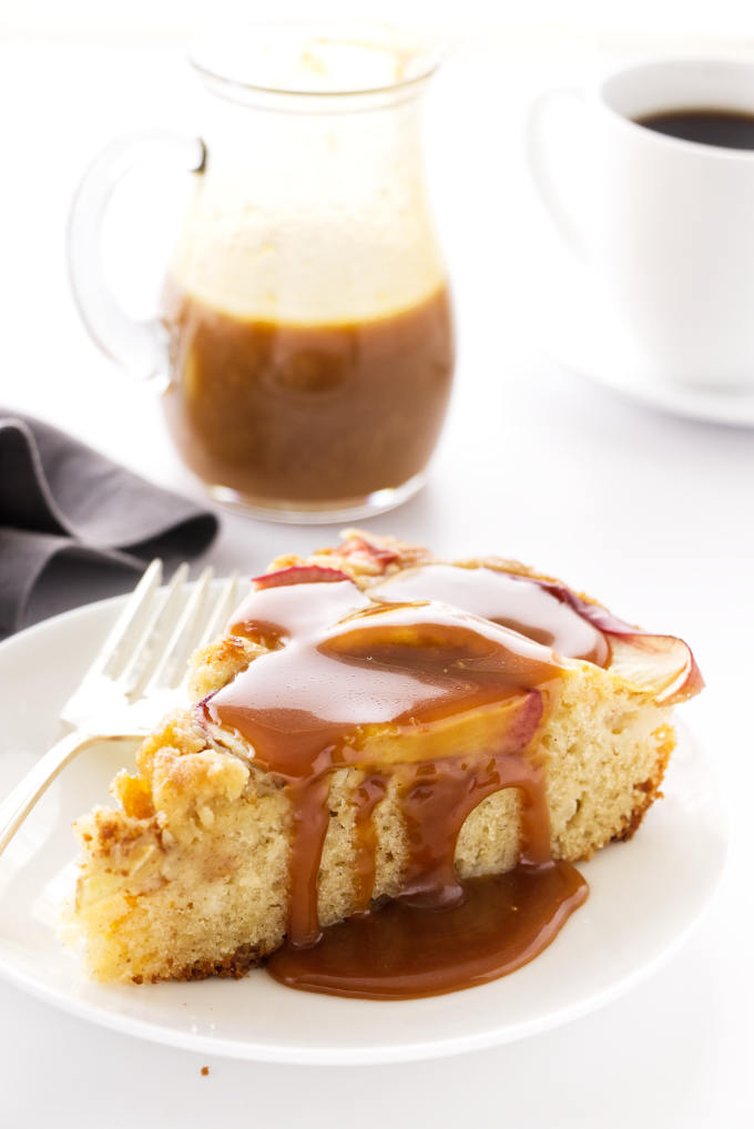 A slice of Apple Skillet Cake and caramel sauce