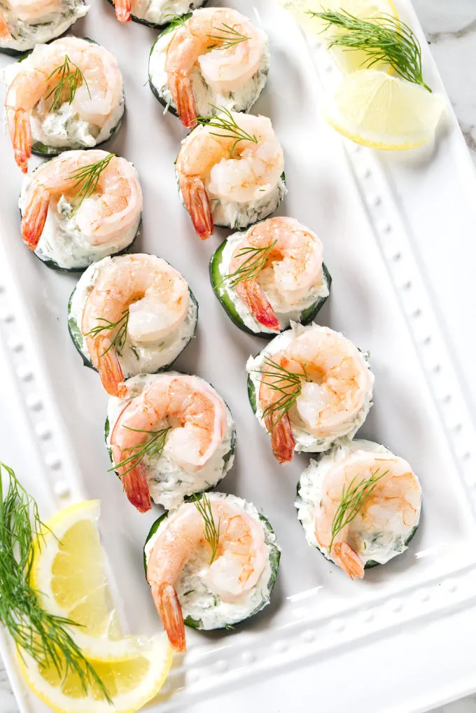 Cucumber rounds with cream cheese and shrimp.