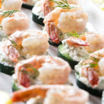 Cucumber shrimp appetizers on a serving platter.