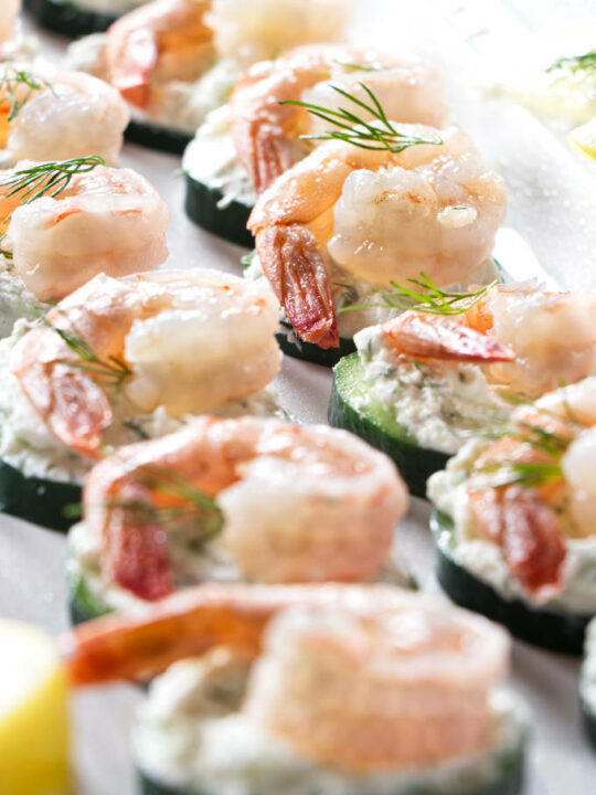 Cucumber shrimp appetizers on a serving platter.