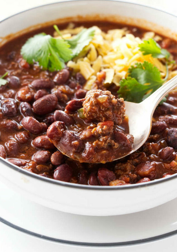 A bowl and spoon with chili beans.