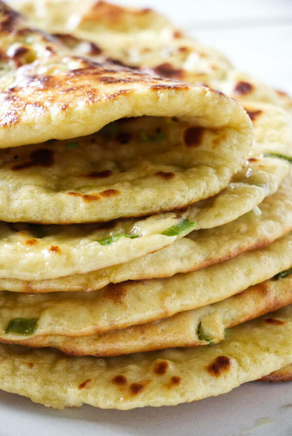 A stack of naan bread made with einkorn flour.