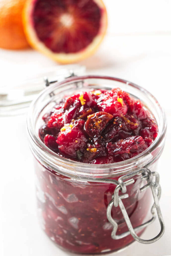 A jar filled with cranberry chutney.