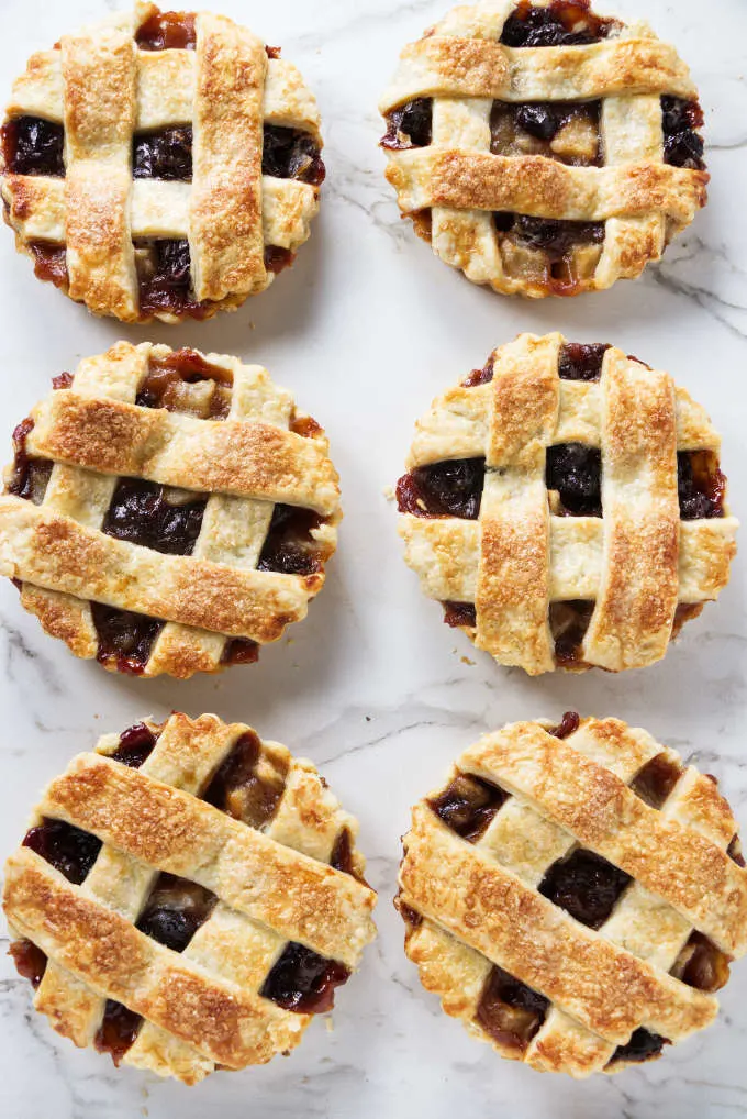 Six individual tarts with dried cherry filling.