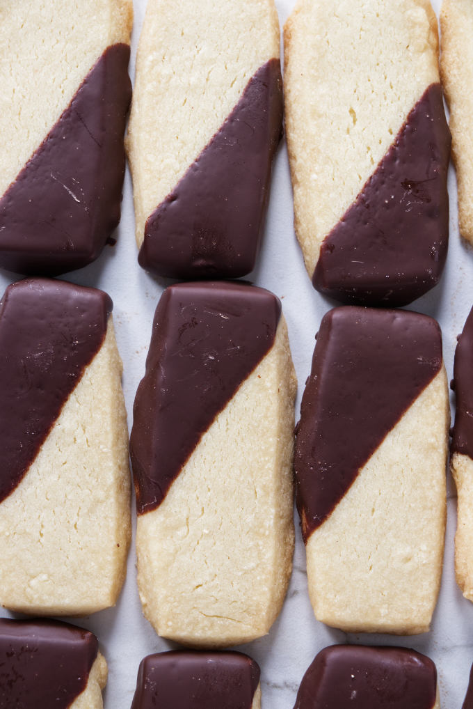 Six shortbread cookies lined up next to each other.