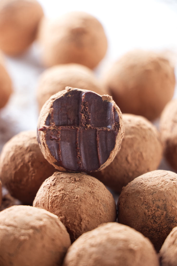 A French chocolate truffle with bite marks.