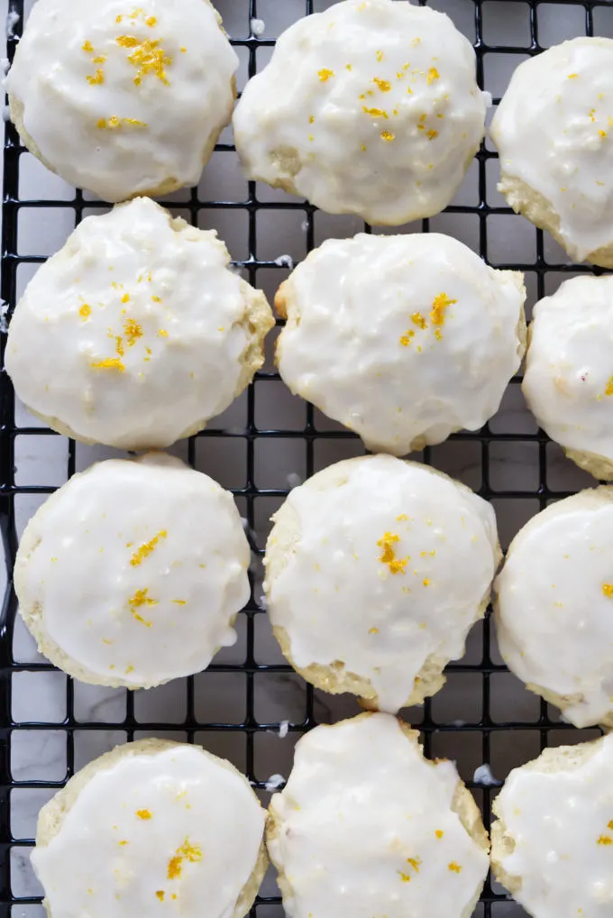 Lemon icing drying on top of ricotta cookies.