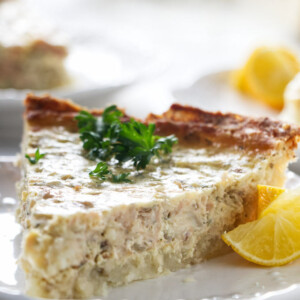 A slice of salmon quiche with a potato crust.