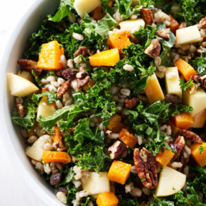 Kale and squash salad mixed with apples and barley.