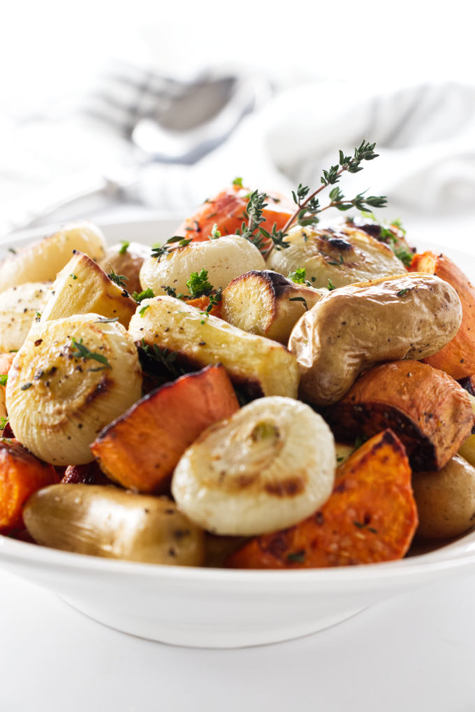A serving dish with roasted root vegetables.