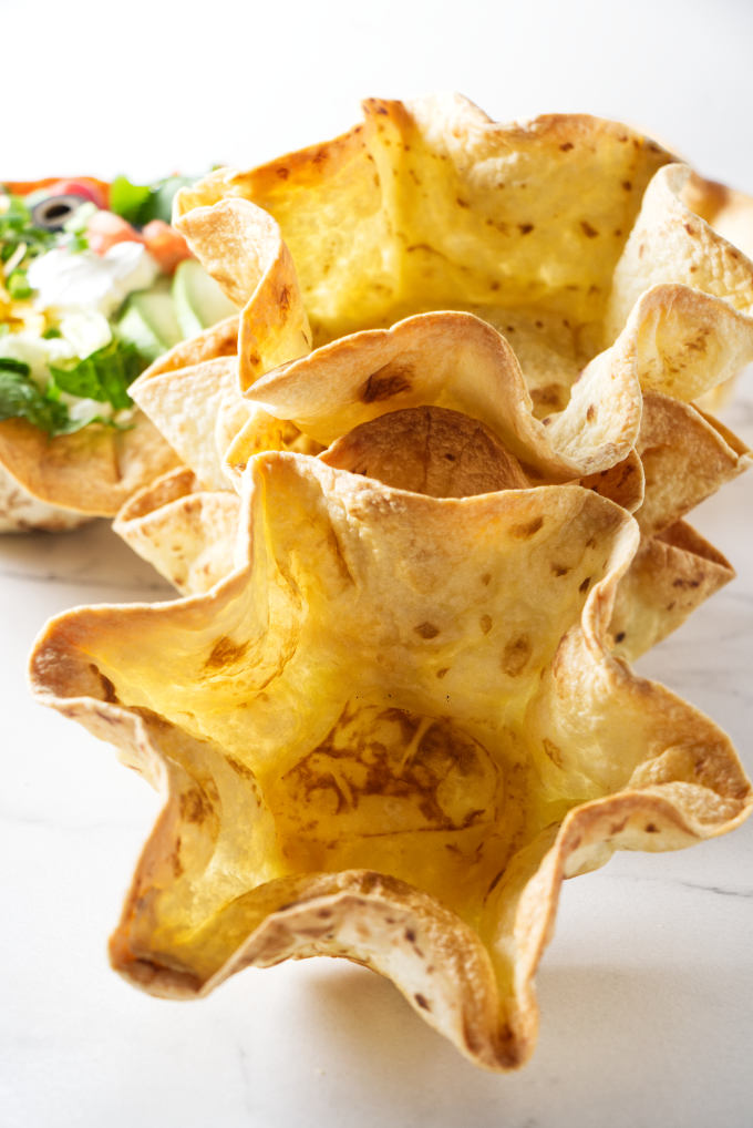 A stack of homemade tortilla bowls.