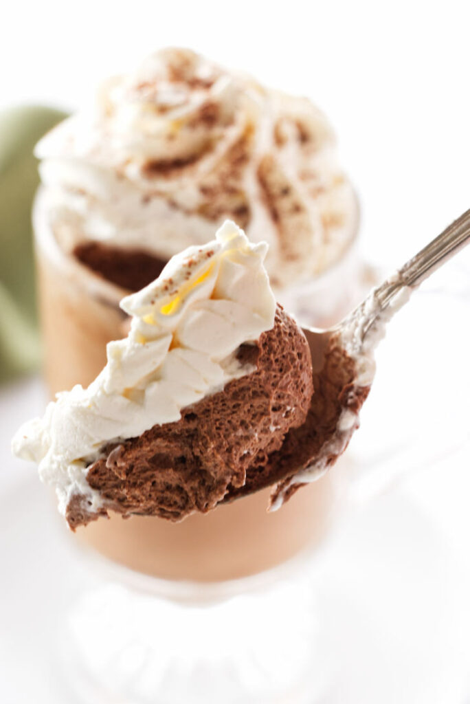 close up of a spoonful of Irish Coffee Mousse with whip cream