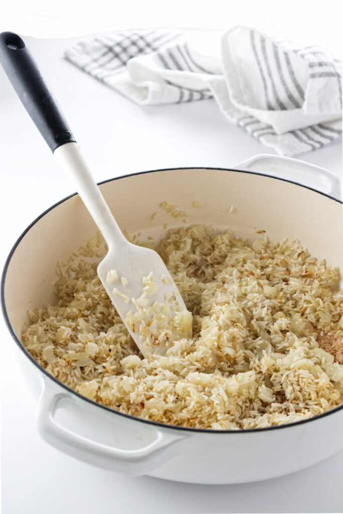 Making basmati rice pilaf in a skillet.