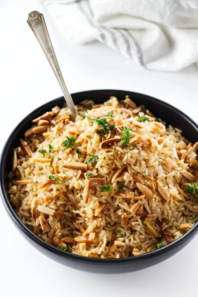 A bowl of Middle Easter rice with almonds.