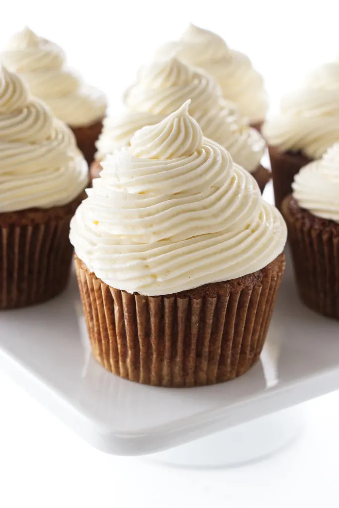 Carrot cake cupcakes on a cake pedestal