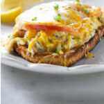 An open face crab melt sandwich.