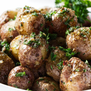 A dish filled with baby potatoes.