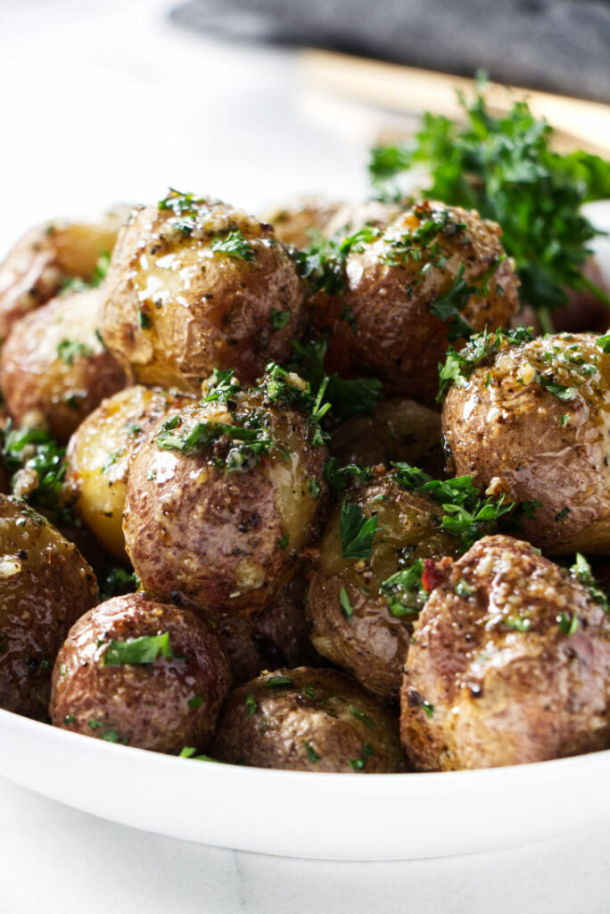 A dish filled with baby potatoes.