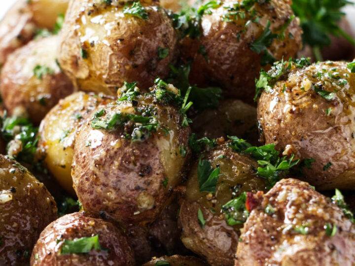A dish filled with baby potatoes.
