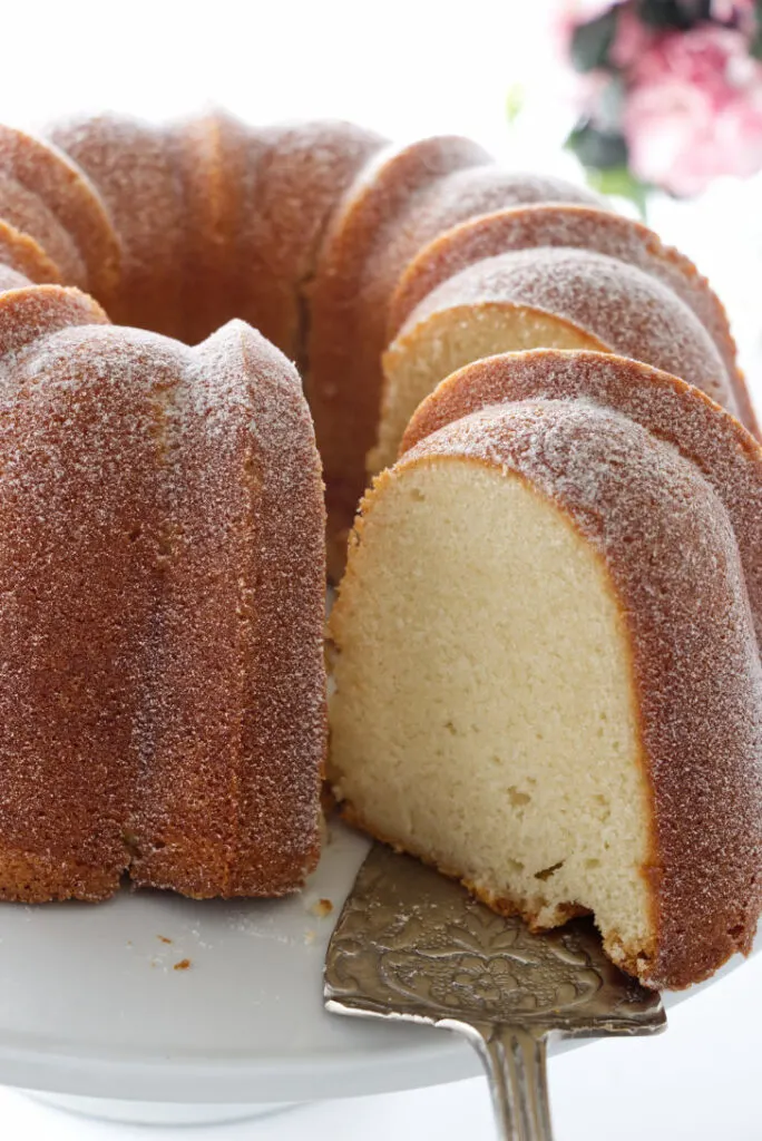 Cold oven pound cake with a slice being removed