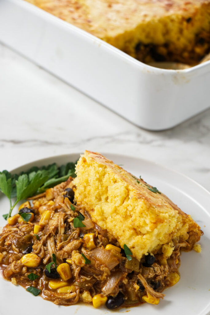 A plated serving of cornbread topped casserole.