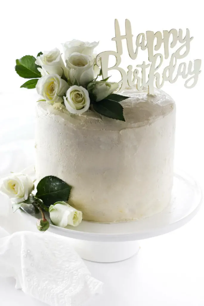 Premium Photo | White cake with the inscription happy birthday on blue  background top view