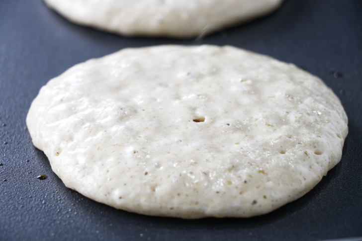 Barley pancake batter on a griddle.