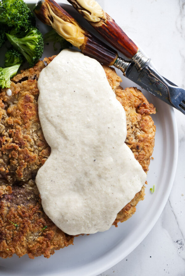 Chicken fried venison topped with cream gravy.