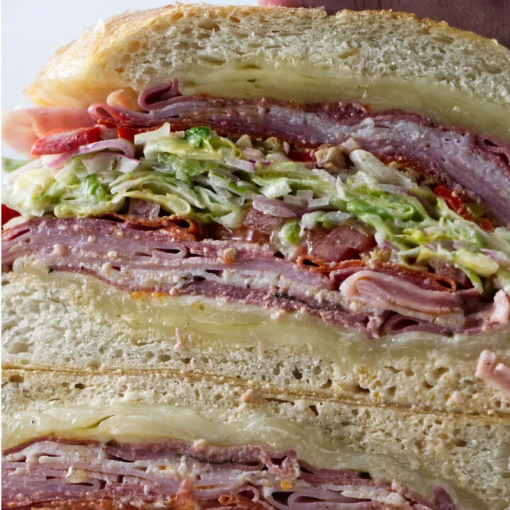 https://savorthebest.com/wp-content/uploads/2022/05/how-to-make-Italian-grinder-salad-sandwich_2216-720x720.jpg.webp