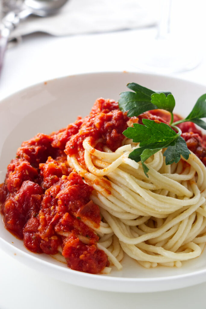 San Marzano sauce on top of noodles.