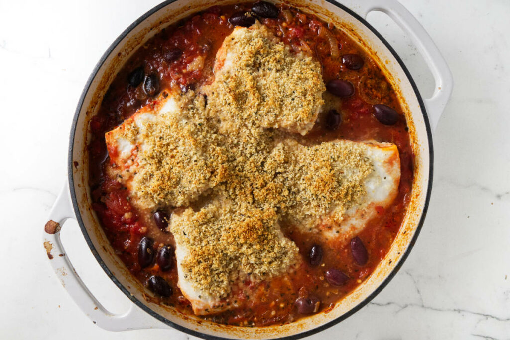 Baked halibut in a Mediterranean tomato sauce.