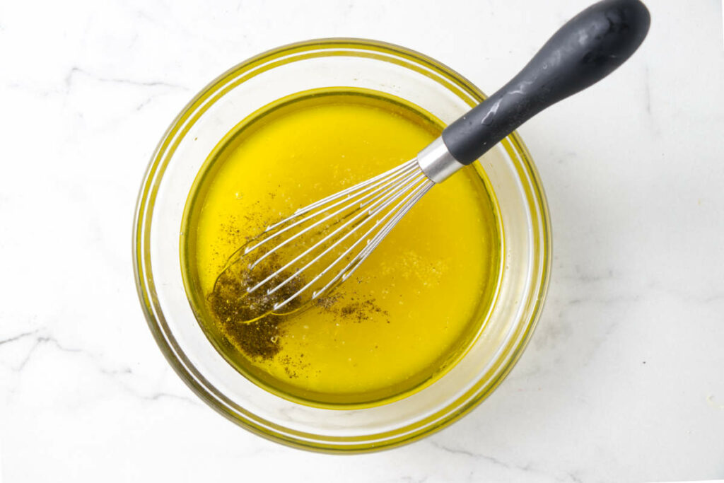 Mixing the dressing for a salad.