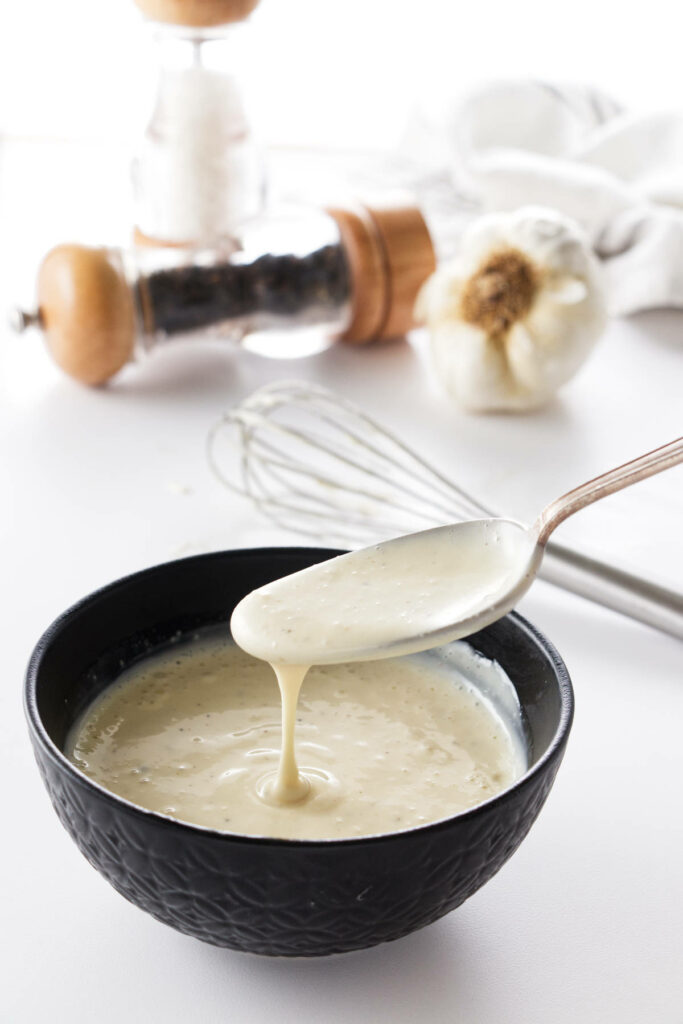 Creamy coleslaw dressing in a bowl