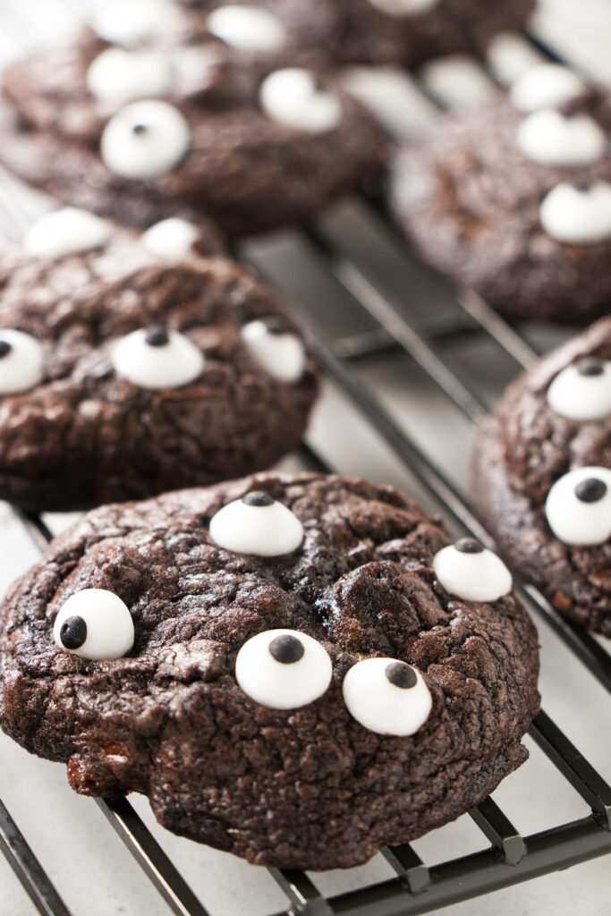 Black cookies with candy eyeballs.