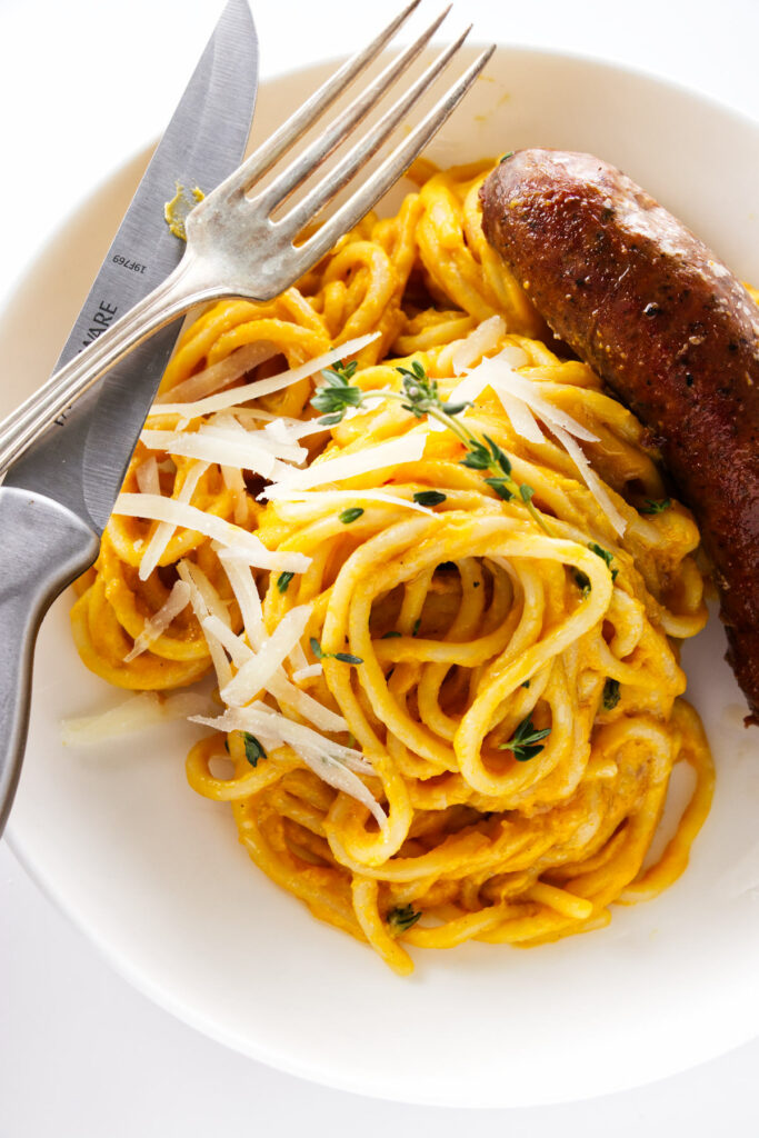 Overhead view of a serving of Butternut Squash Pasta with Spicy Italian Sausage