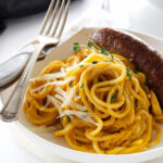 A dish of Butternut Squash Pasta with spicy Italian Sausage