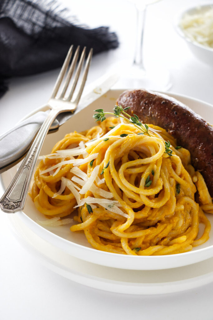 A dish of Butternut Squash Pasta with spicy Italian Sausage