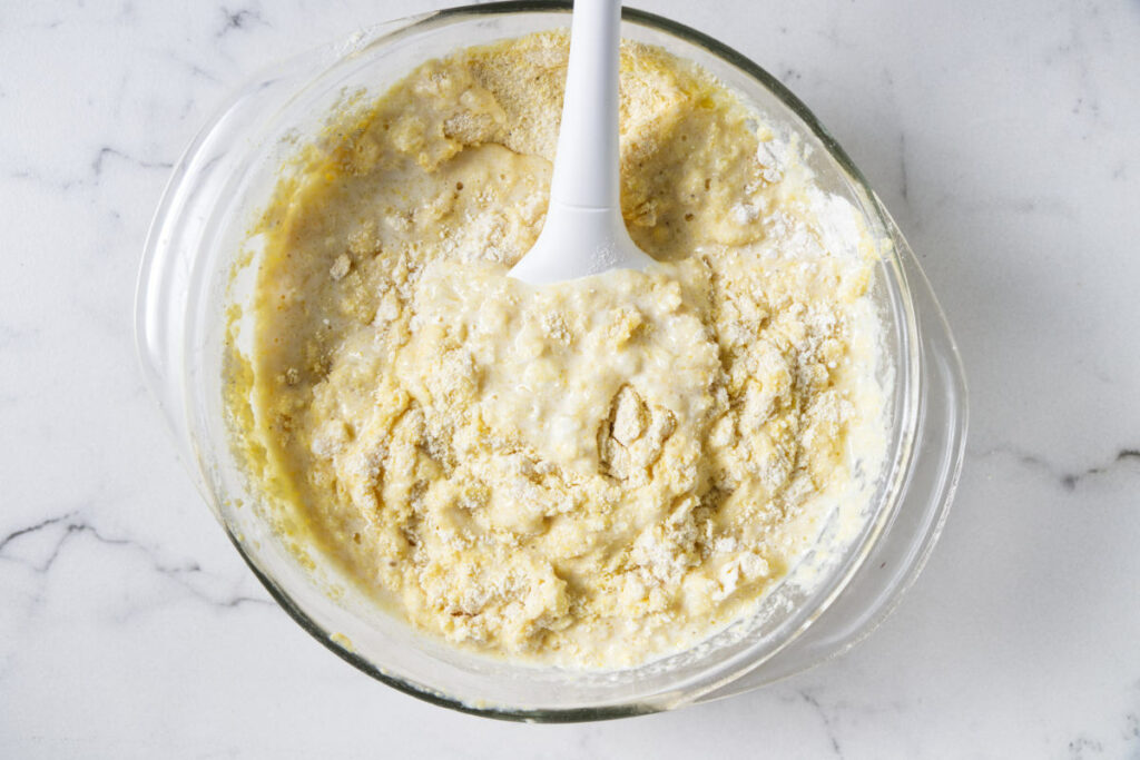 Mixing cornbread batter.