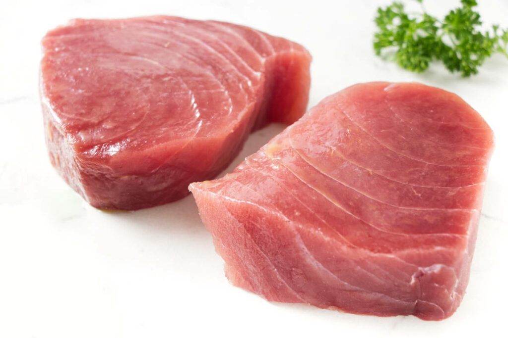 Two fresh Ahi tuna steaks.