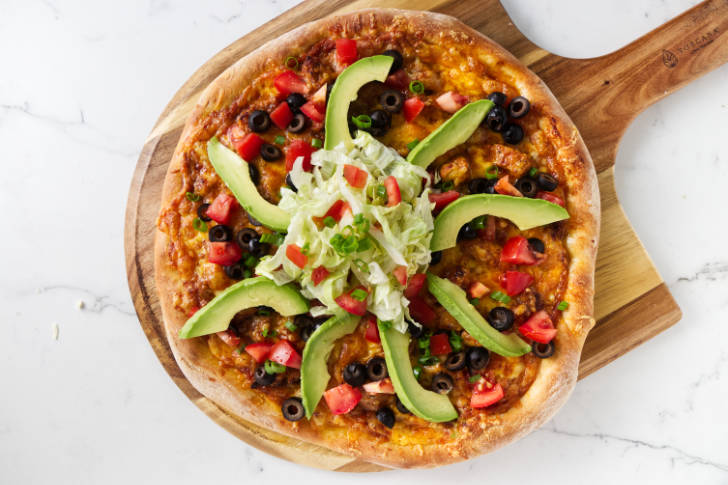 All the toppings on a taco pizza.