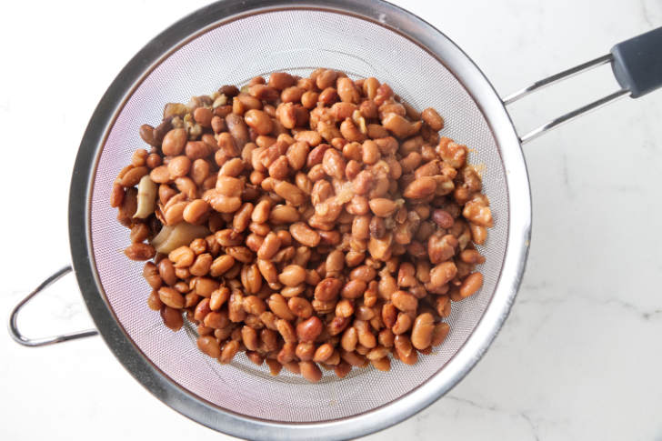 Beans in a strainer.