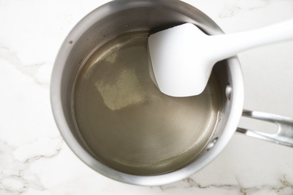 Making the seasoned vinegar for sushi rice.